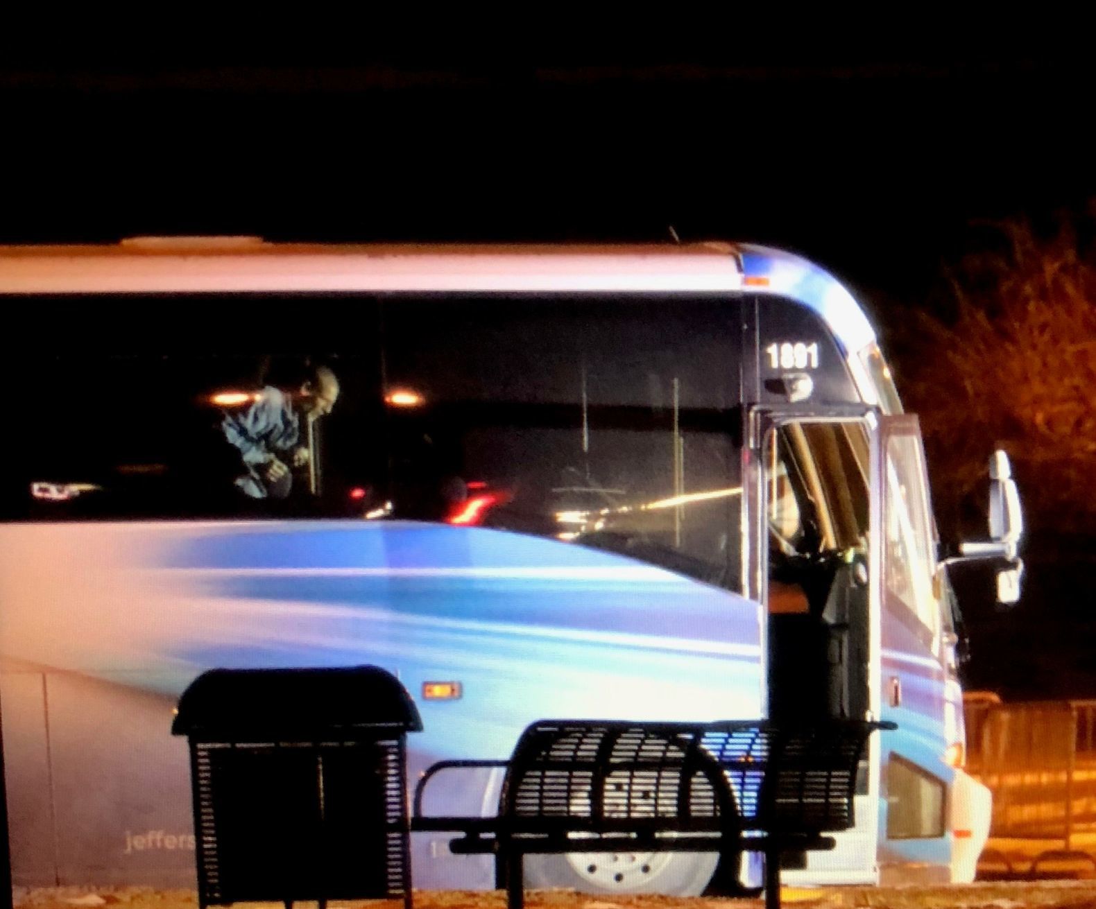 Suspect paces inside the bus